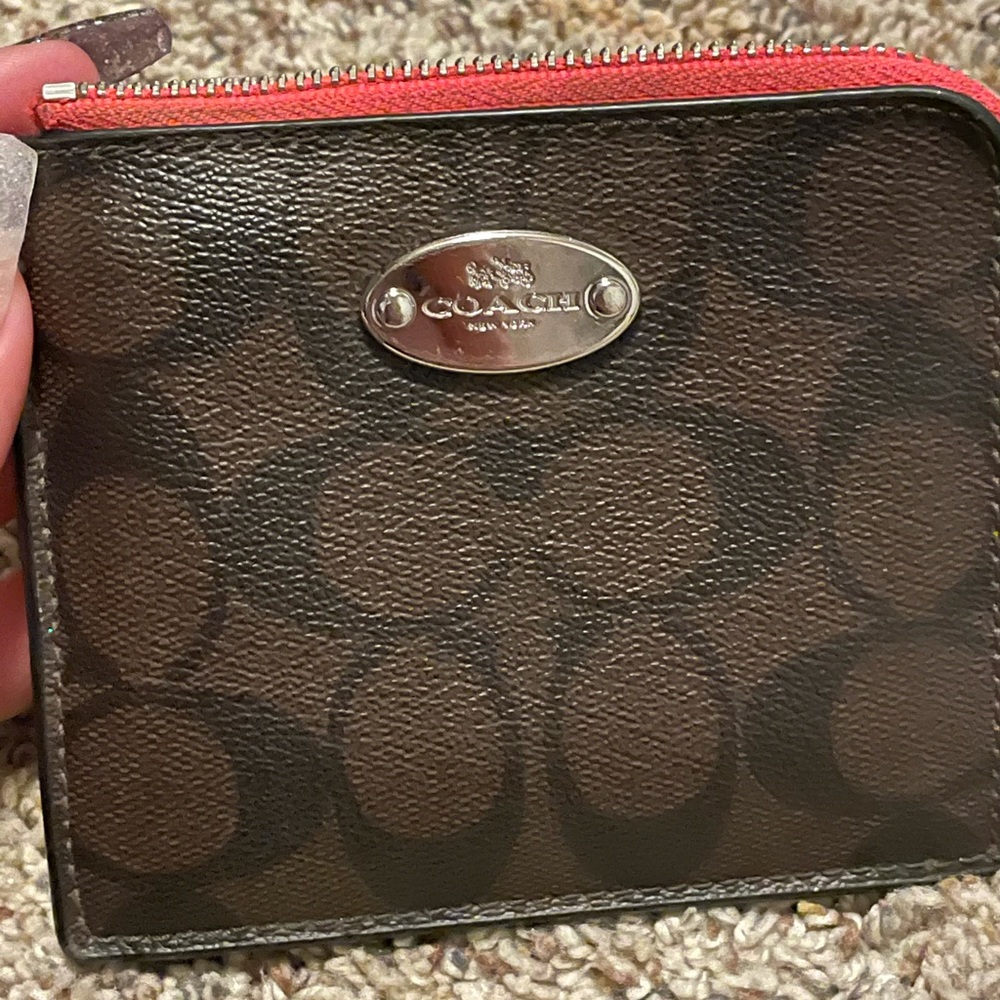 Coach leather and neon pink trim and lining wallet